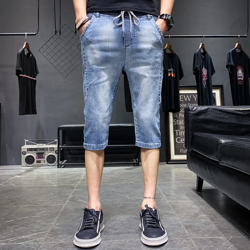 Мужские Стрейчевые шорты синие джинсовые до колена с плетеным ремешком на