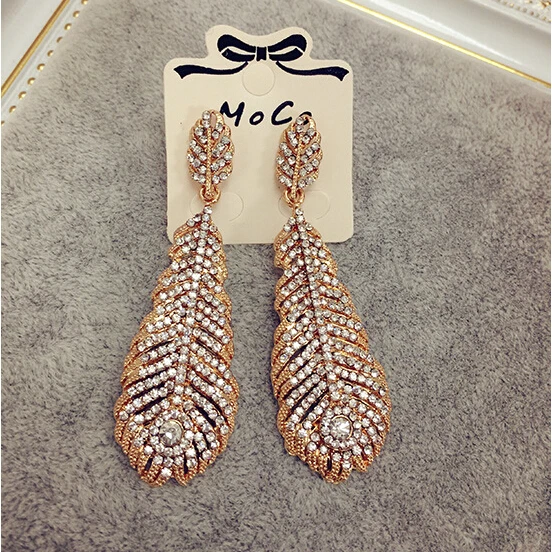 Free shipping!!The European and American fashion vintage gem women's earrings feather shape ears hanging | Украшения и