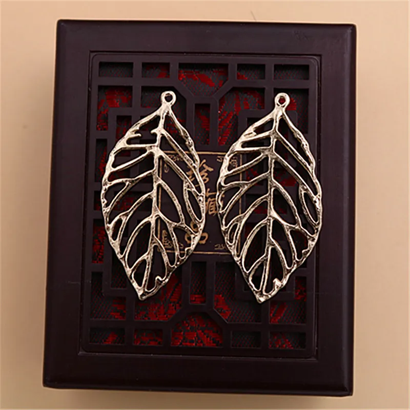 

WKOUD 8pcs kc golden hollow leaves charm alloy pendant fashion necklace bracelet DIY metal jewelry makings A1466