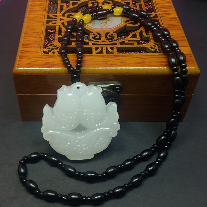 

Genuine natural white jade pendant Pisces peace Afghanistan white jade carved hollow double white level Pisces Pendantroom Art