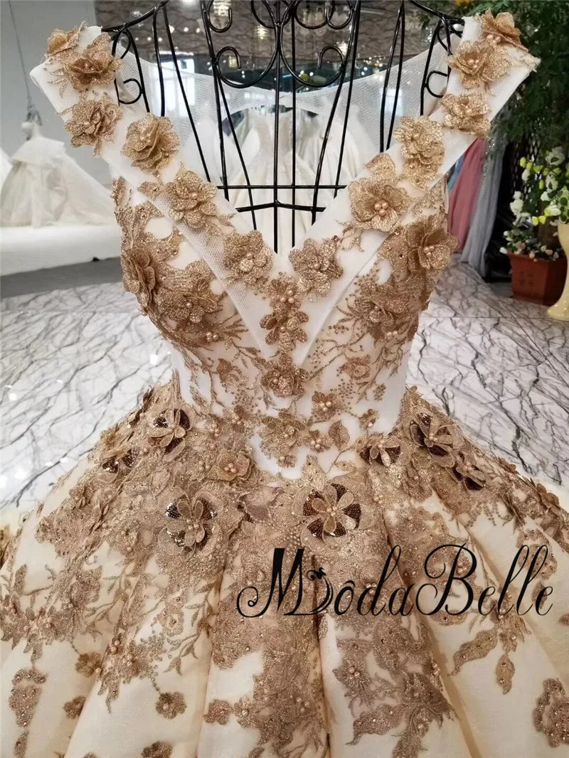 Платье для свадьбы Modabelle Deluxe цвета шампанского золотого с объемным цветком