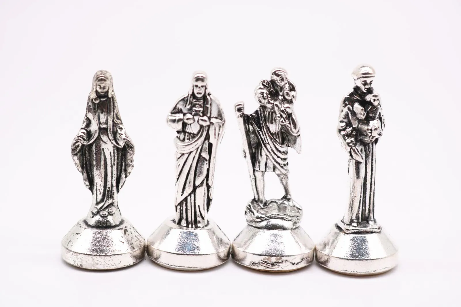 

Many styles of Christian decorations. Jesus, Madonna Maria, Rose, Lady Fatima, Figurine. Car dashboard decoration.