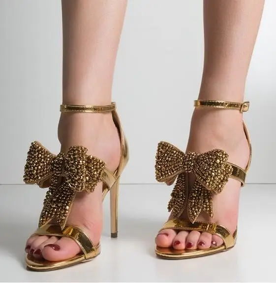 

Moraima Snc Hot Selling Gold Metallic Leather High Heel Sandal Summer Open Toe Crystal Bowknot Gladiator Shoes Woman Dress Heels