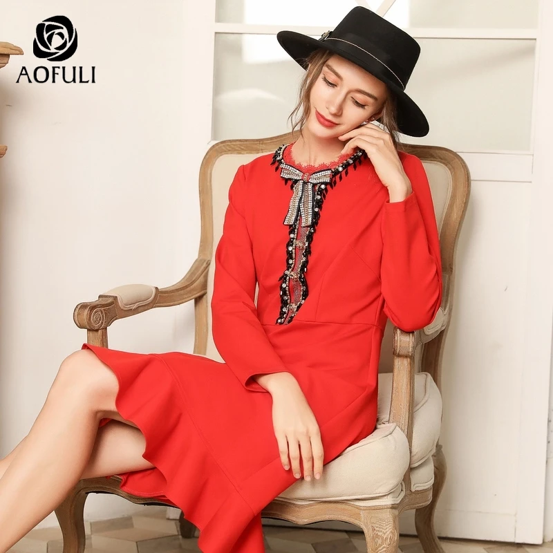 Женское платье с бантом и стразами осеннее длинным рукавом рюшами большие