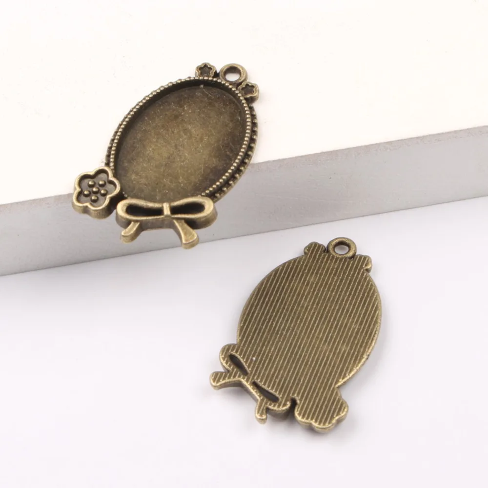 

reidgaller 10pcs antique bronze/silver oval cabochon setting 18x25mm blank pendant base diy metal bezels in jewelry making