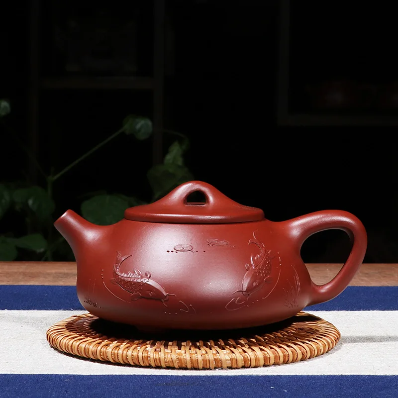

Yixing purple clay Fish Teapot Stone scoop pot Qing cement teapot Author: jing hua ji Hi Quality Ball Hole Limited