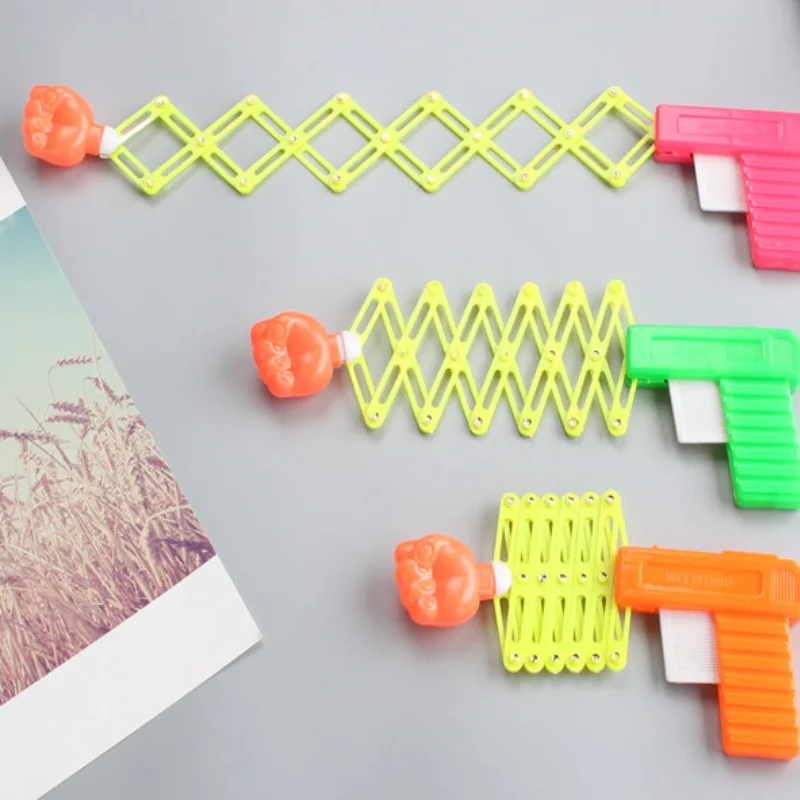 Выдвижной кулак шутер игрушечный пистолет забавный детский пластиковый