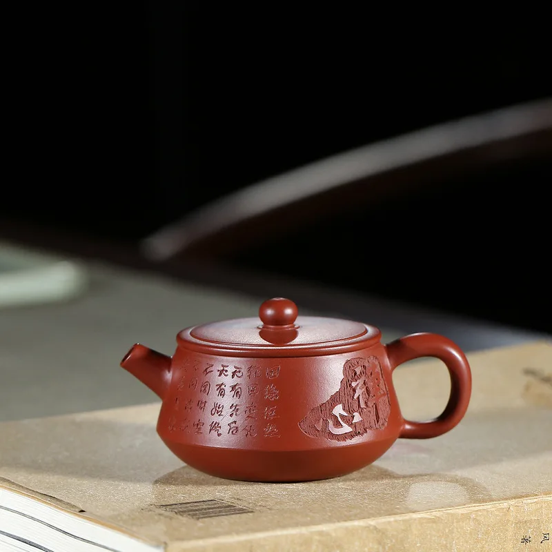 

The famous Yixing purple clay pot is handcrafted raw ore Dahongpao small stone ladle pot Kungfu Teapot Tea Set 110 ml