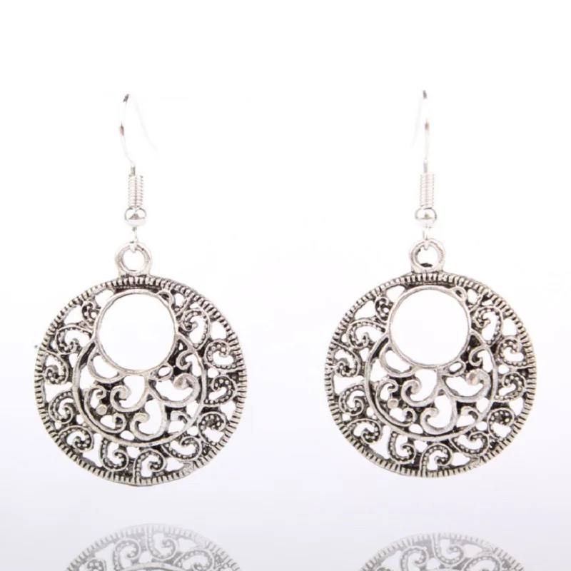 

Bohemian Retro Tibetan silver earrings hollow carved ornamentation you