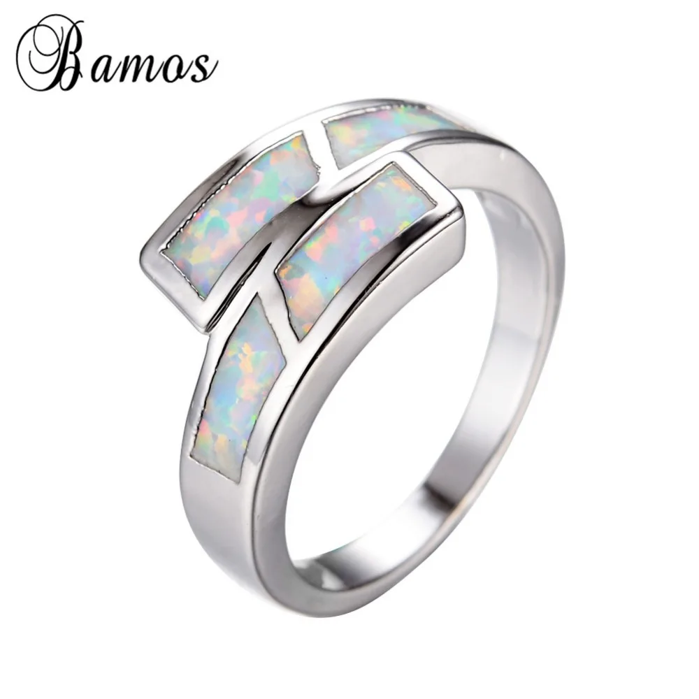 Кольцо женское и мужское из белого золота с радужным огненным опалом | Украшения