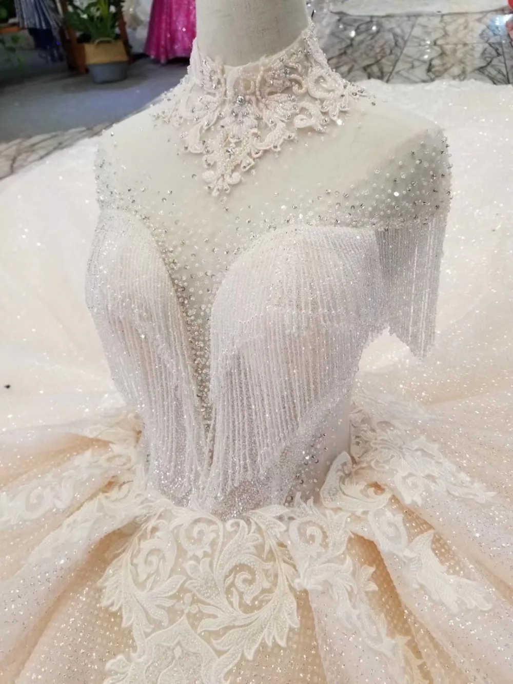 Dolcevita в pizzo lustrini con frange e scollo lupetto abiti da sposa класса люкс и блестящим кружевным верхом