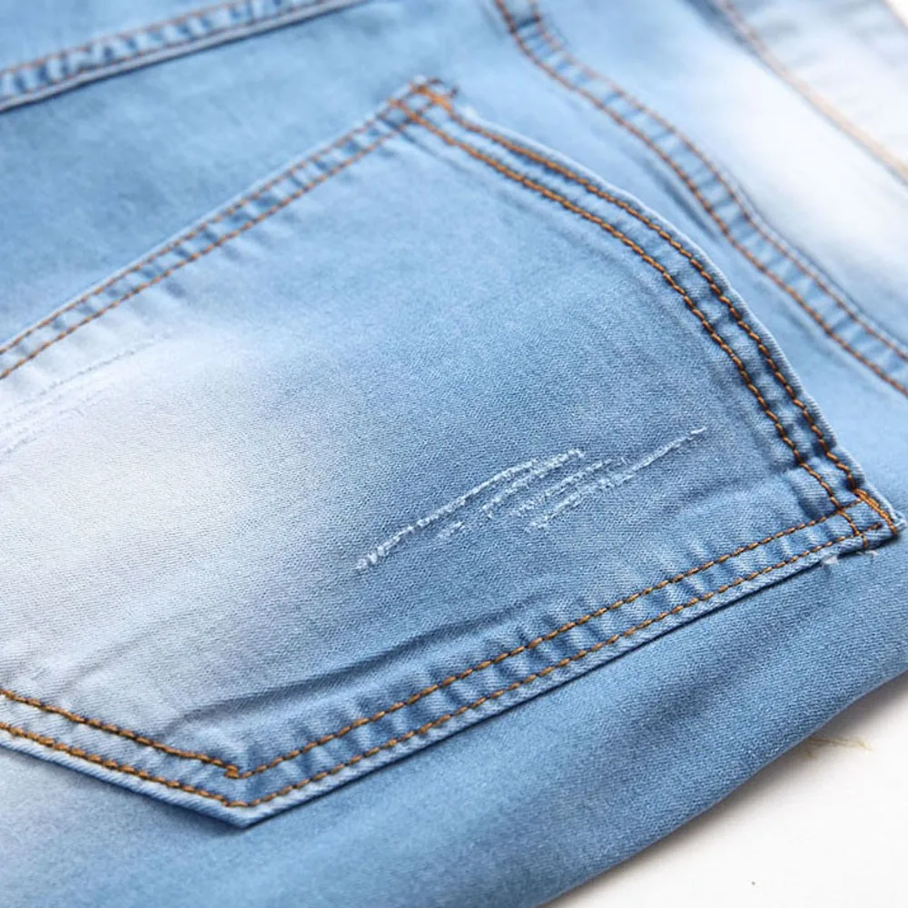 Мужские джинсы с дырками облегающие модные подчеркивающие индивидуальность