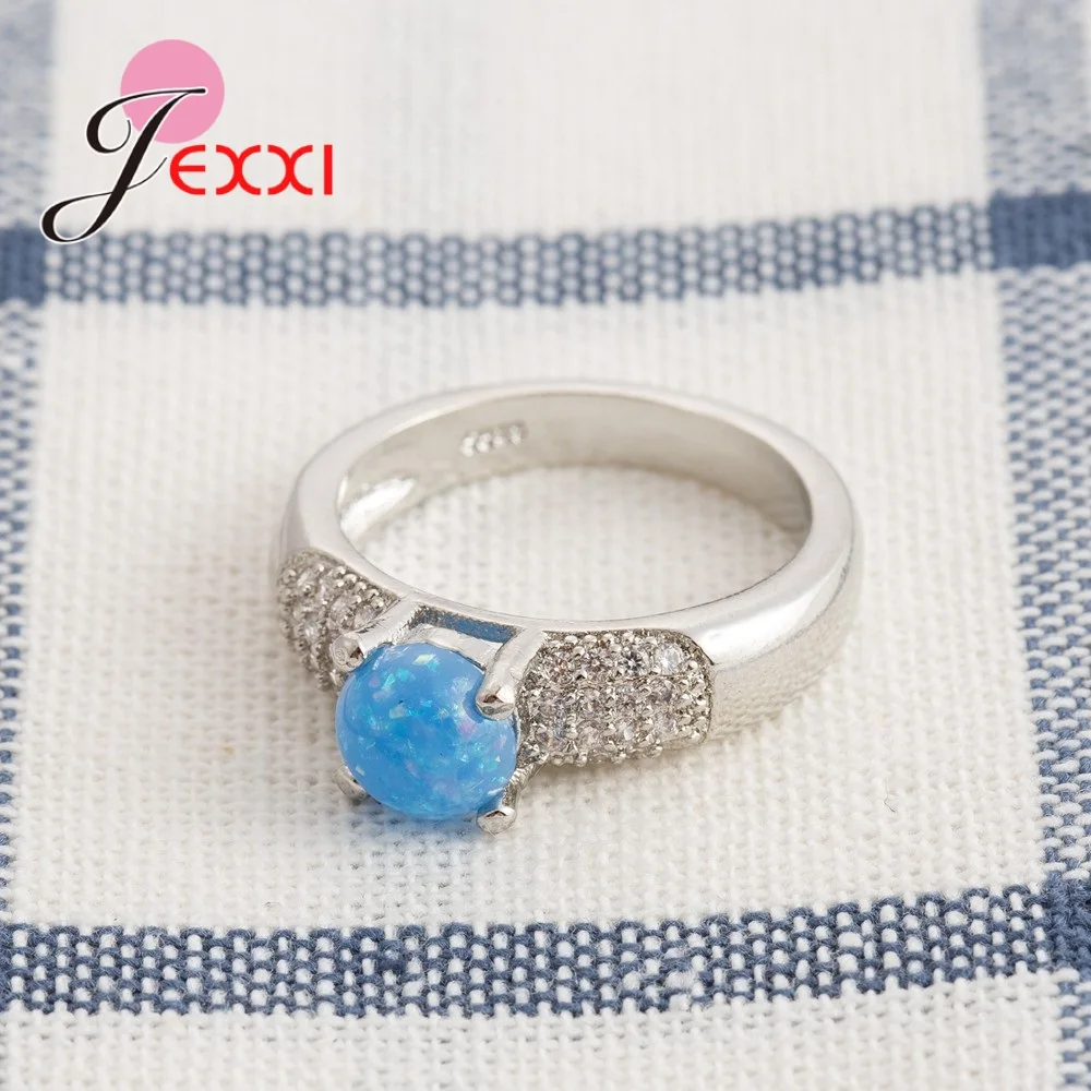 Женское ювелирное изделие с круглым опалом серебро 925 пробы