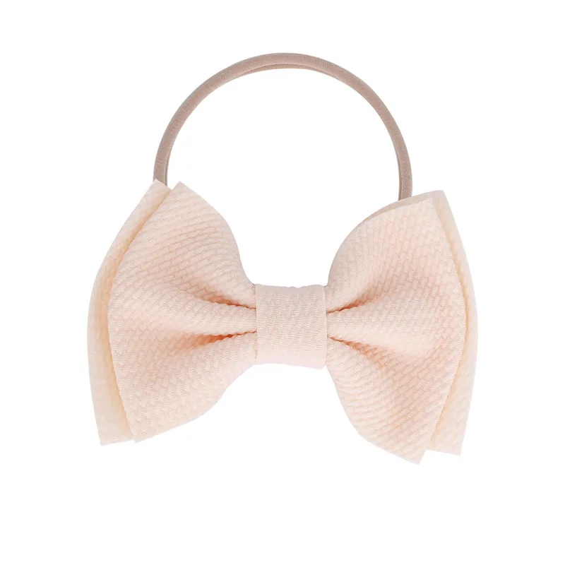 Повязка на голову с бантом ig для девочек телесный нейлоновый стиль большой