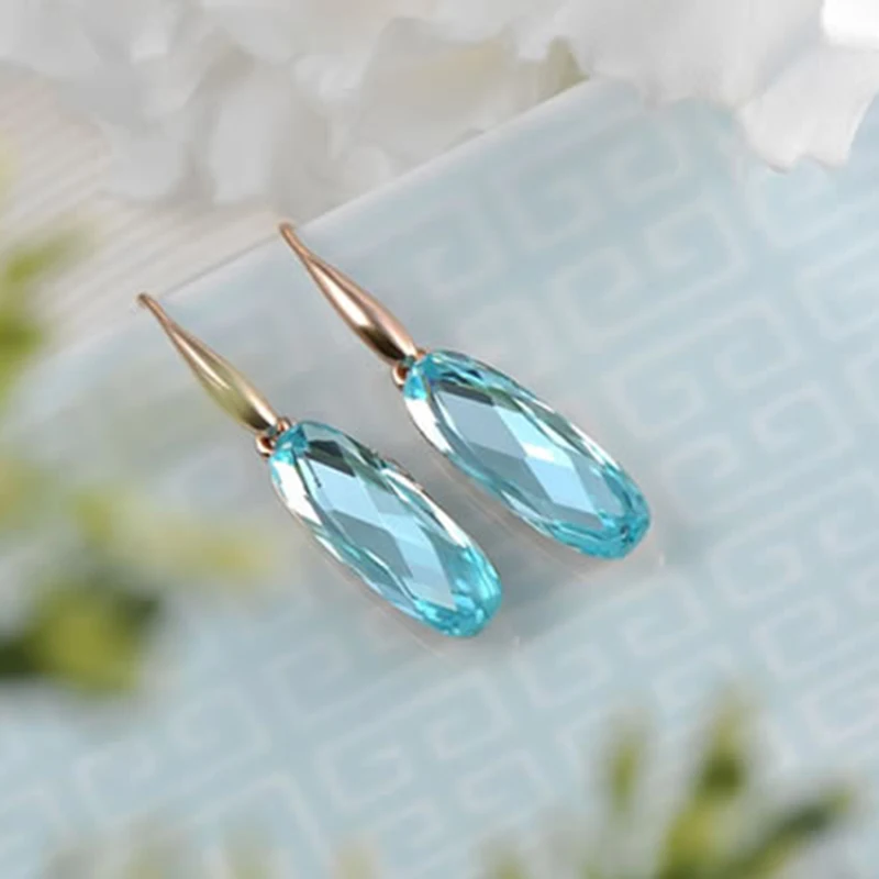 Роскошные серьги гвоздики GS цвета розового золота с цирконом и синим кристаллом