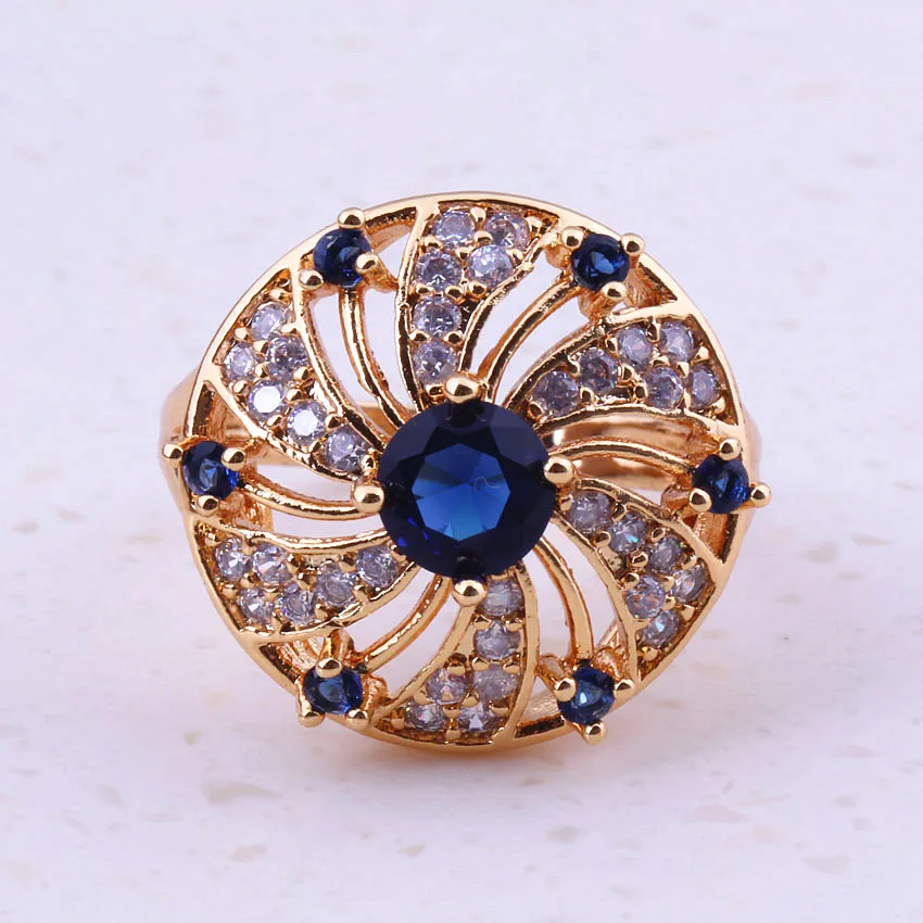 Кольцо женское золотистое с голубым кристаллом и фианитом в подарочной коробке