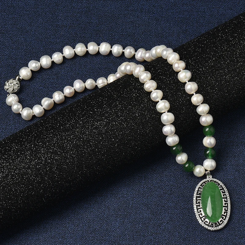 

Freshwater Natural Pearl Necklace Having 25*39*10 MM Pure green oval Pendant and the Milk white Tiny Pearl Beads with Dark green