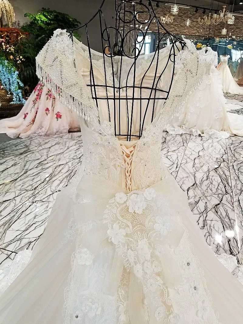 LS00302 свадебное платьебез спинки крышка рукава большой лук назад кружева бальное