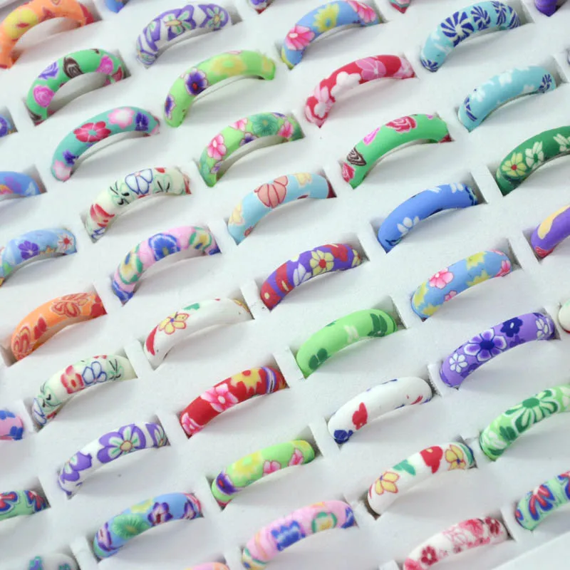 

100Pcs New Lovely Cartoon Flowers Soft glue Ring For Women Girls Soft Rubber Jewelry Environmental Protection LR4064