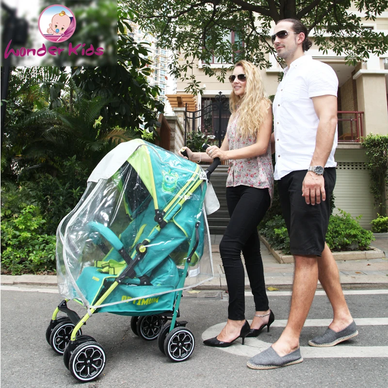 Универсальный накрывной чехол от дождя, ветра и пыли для коляски для младенцев с обратной солнцезащитой и карманом аксессуаров.