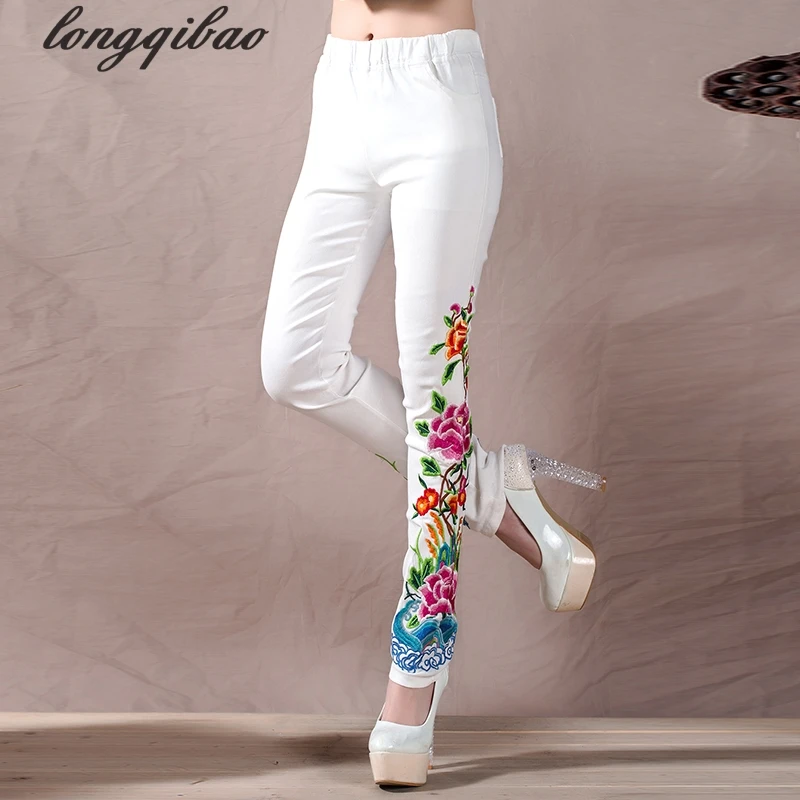 Женские брюки с цветочной вышивкой черные и белые повседневные обтягивающие