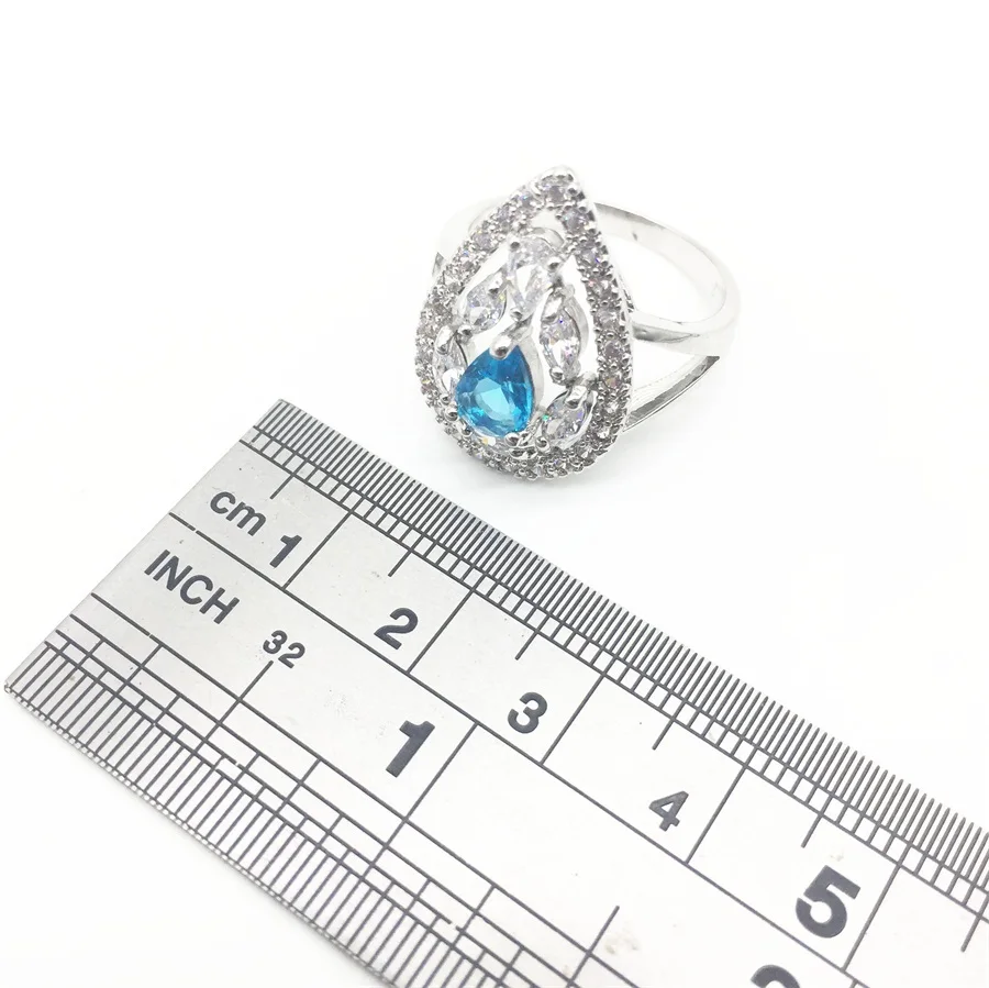 Женское серебряное ювелирное изделие сережки с подвеской в виде ожерелья синим