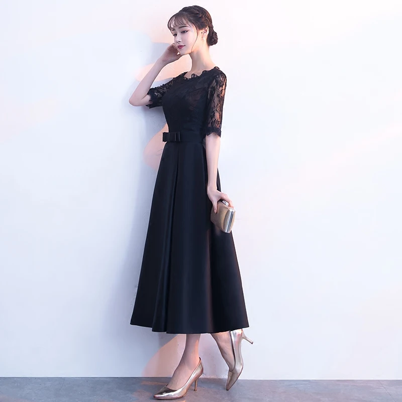 Женское вечернее платье до середины икры черное облегающее с тонкой талией