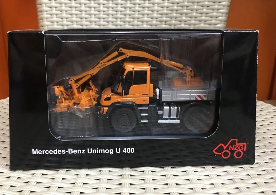Mercedes-Benz Unimog U 430 с комбинированной косилкой оранжевый 1/50 от NZG 9101