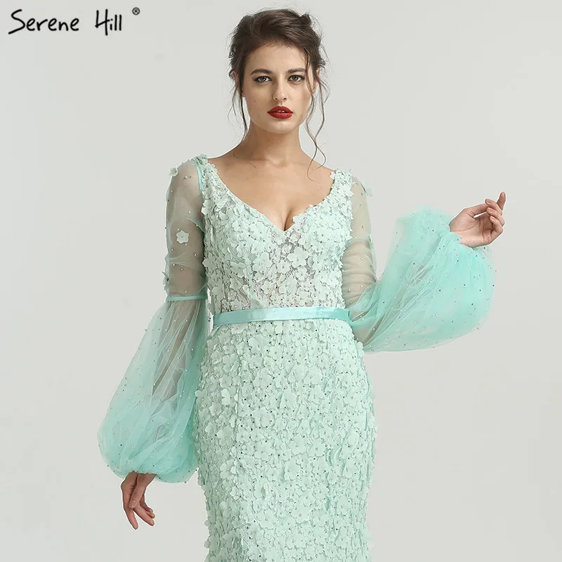 Женское вечернее платье с длинным рукавом мятно-зеленого цвета украшенное