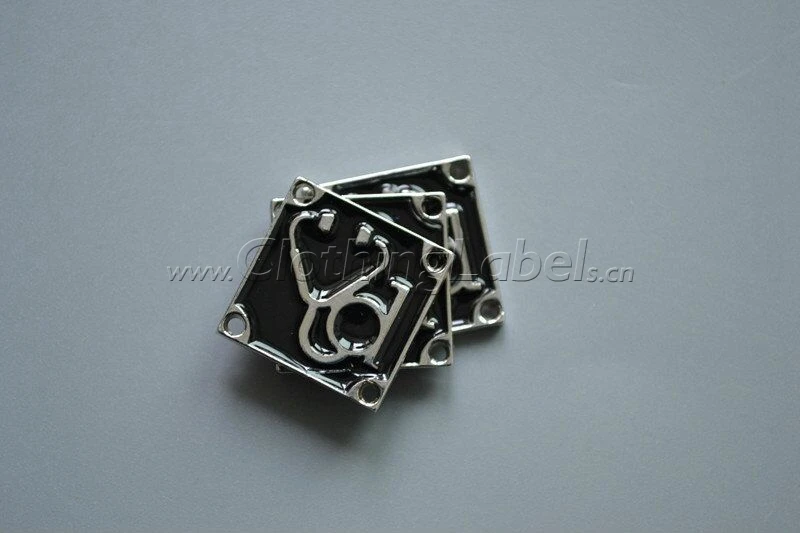 

custom metal labels,black expoxy, embossed logo, silver color, 4 holes on each corner