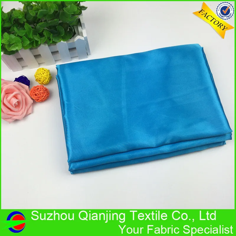 Блестящая гладкая мягкая кислота синяя полиэфирная атласная ткань высокого