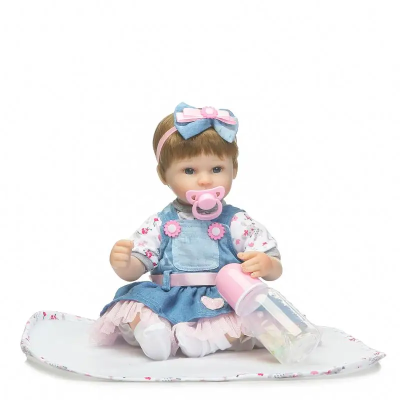 

42cm Sweet Lifelike Newborn Baby Girl with Denim Skirt and Head Ornaments Silicone Reborn Baby Dolls Kids New Year Gifts