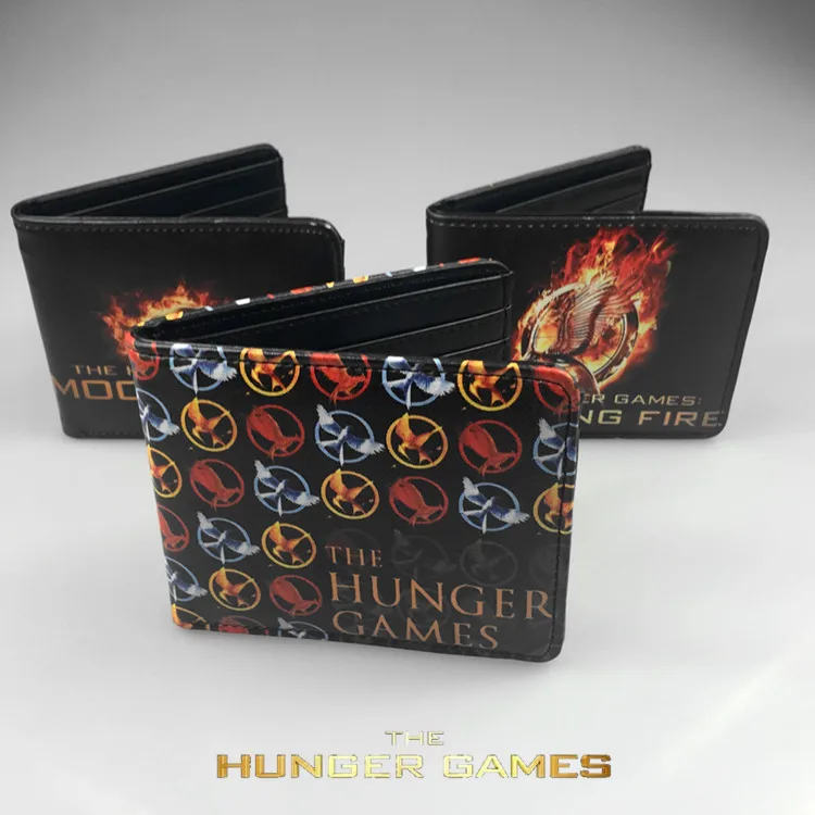 The movie hunger games около трех значков разделяющая птица смеется над кошельком Голодные