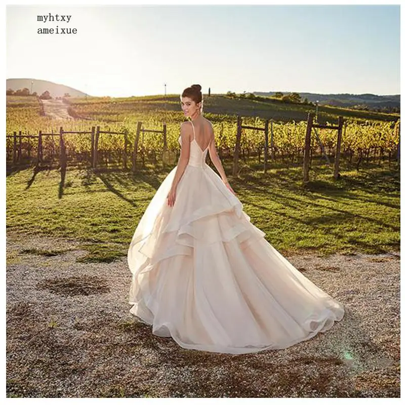 

Beach Wedding Dresses Spaghetti Strap Champagne A Line Tulle Backless Princess Long Wedding Gown Boho Bride Dress 2020 Casamento