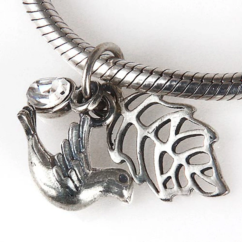 Подвеска-Голубь из серебра 100% пробы с австралийским хрустальным яйцом |