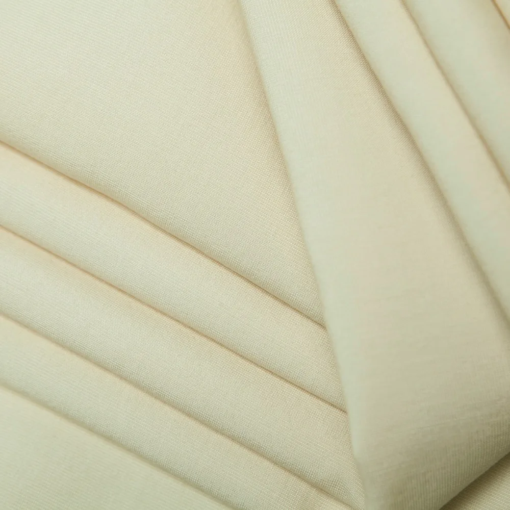 Двухсторонняя шерстяная ткань окрашенная в пряжку бежевого цвета блестящая