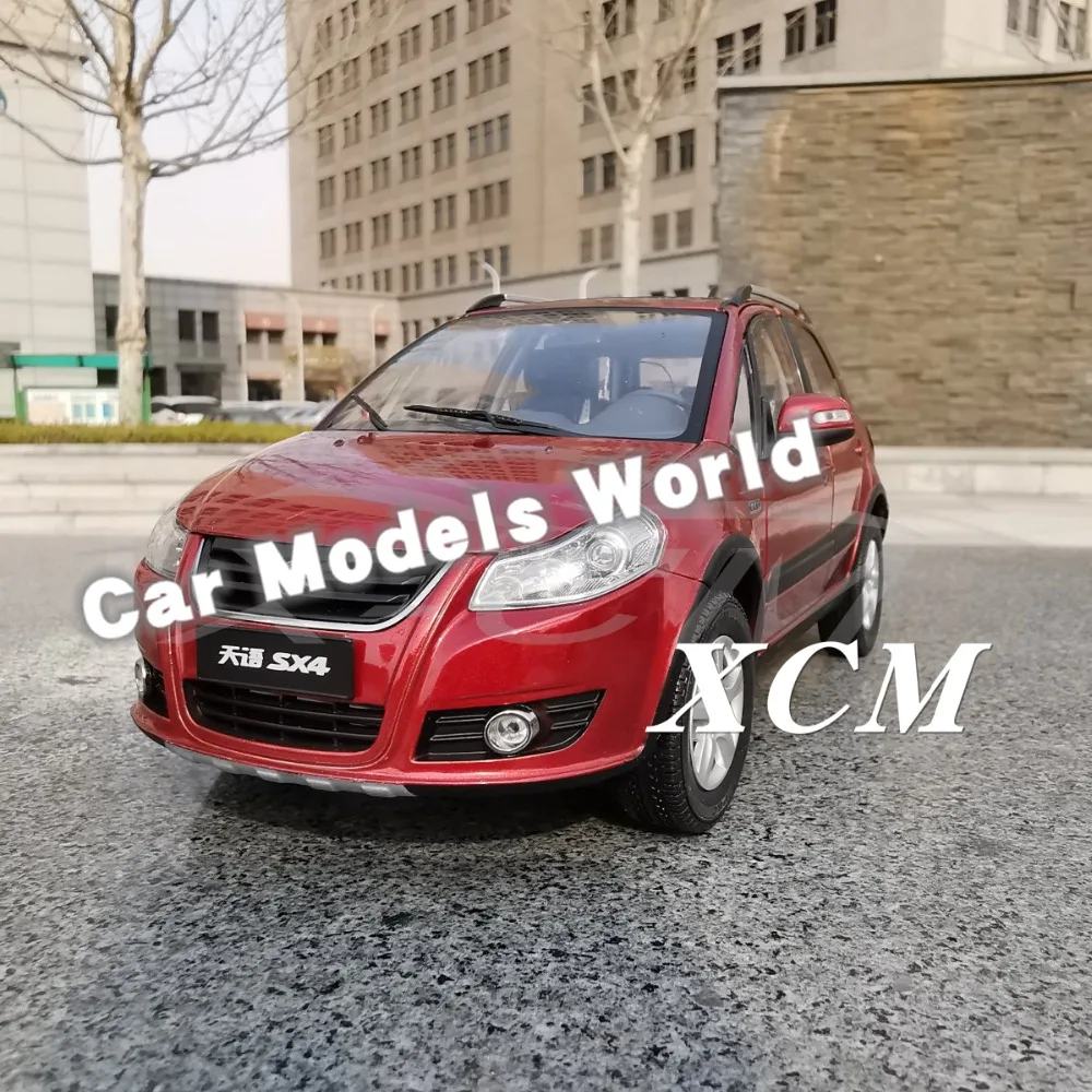 Модель литая автомобиля для кроссовера SX4 (оранжево красный) 1:18 + небольшой