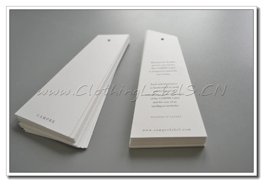 

Custom printed clothing tags with black printing, cut in shape, matt coating