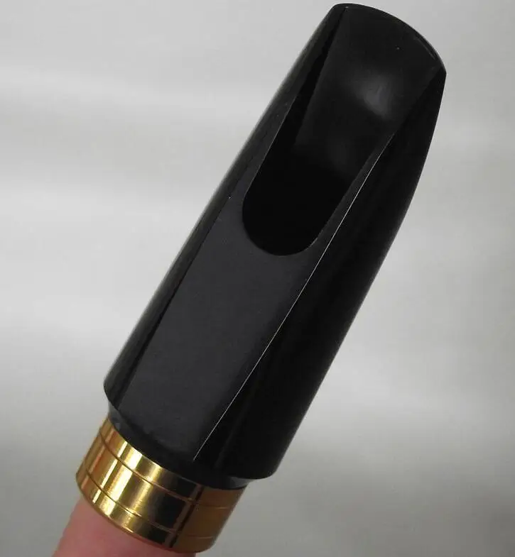 

Hard rubber +metal soprano sax mouthpiece Good material