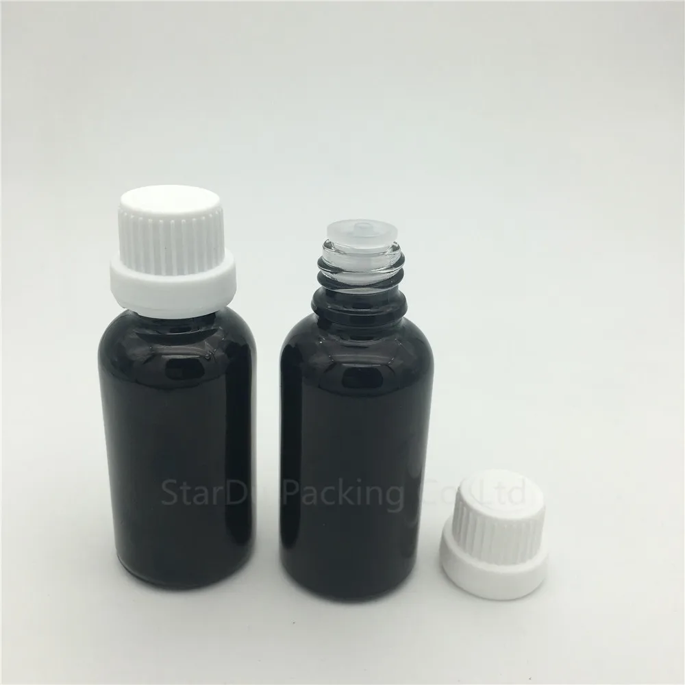 

Free Shipping 200pcs 30ML Black Glass Bottle , 1oz Vials Essential Oil Bottle with tamper evident cap Perfume bottles