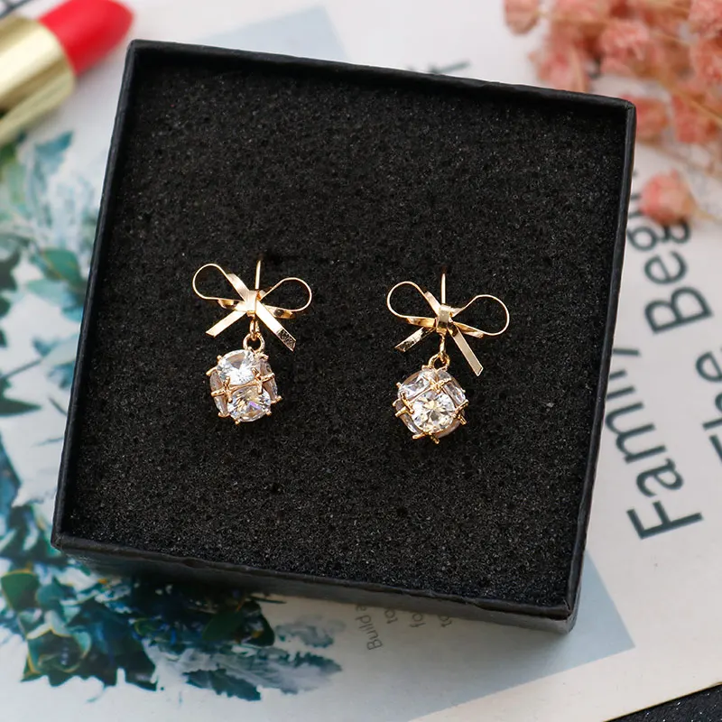 European and American fashion long bow copper material women's ear nail party earrings