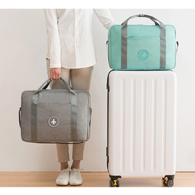 

Fashion New High Quality Folding Travel Bags Hand Luggage For Men And Women Duffle Bag Portable Luggage Storage Clothing Bags