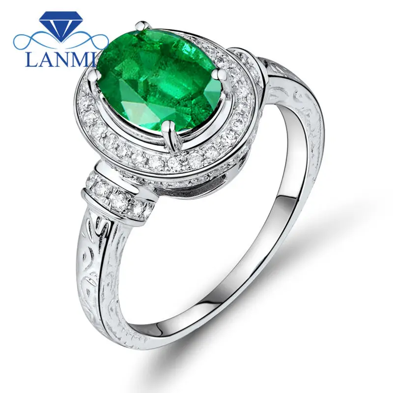 Кольца из белого золота с изумрудами и бриллиантами 14 к овальной огранки 7x9 мм