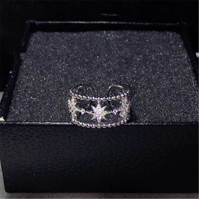 Женское кольцо с кристаллами серебристый цвет открыт пробы полой звездой модный