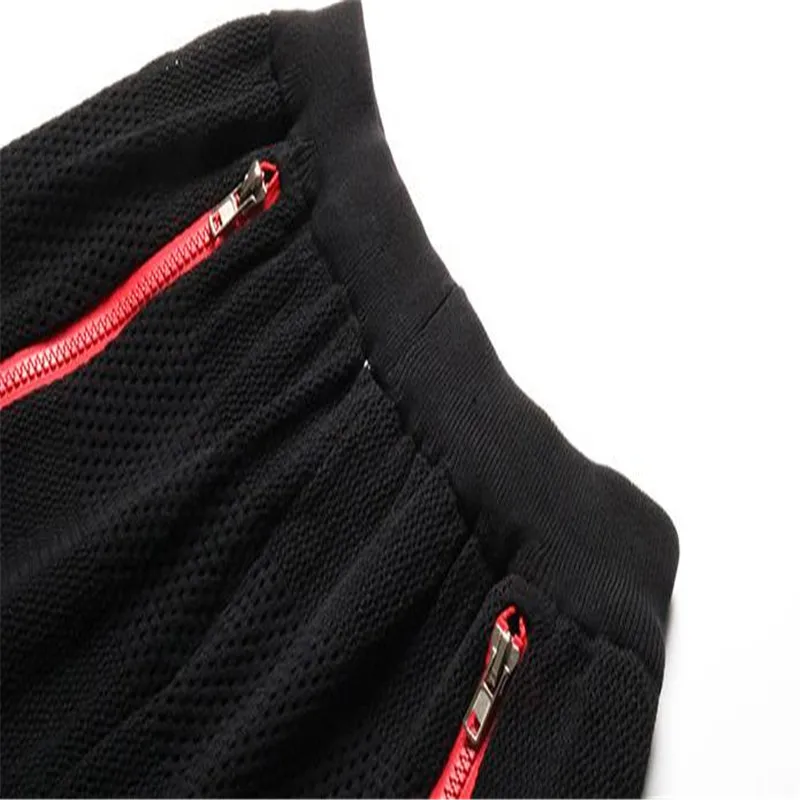 Женские летние дизайнерские брюки на молнии однотонные спортивные с дырками