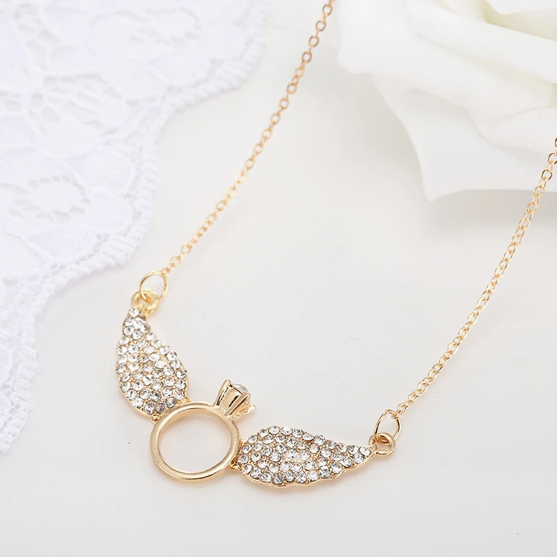 Ожерелье с подвеской в виде крыла кристаллами золотого цвета|necklace pendant gold|stone