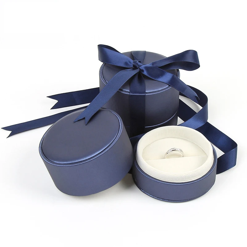 

8.2*6.5cm Blue and Goden color PU Round shape Jewelry Box With Bowknot the MOQ Is 300pcs and With any LOGO Of your Low Price