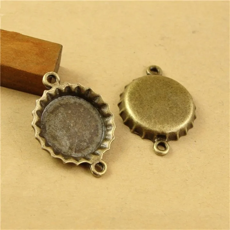 

(60 pieces/lot) To fit 14mm round cabochon antique bronze Color vintage style alloy pendant tray settings with 2 loops hd1323