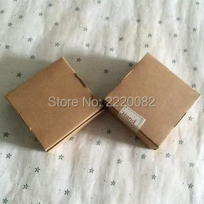 

Free shipping 50pcs a lot 5.8x5.8x3.2cm kraft paper packing box/lovely jewelry case with openings/cute candy box