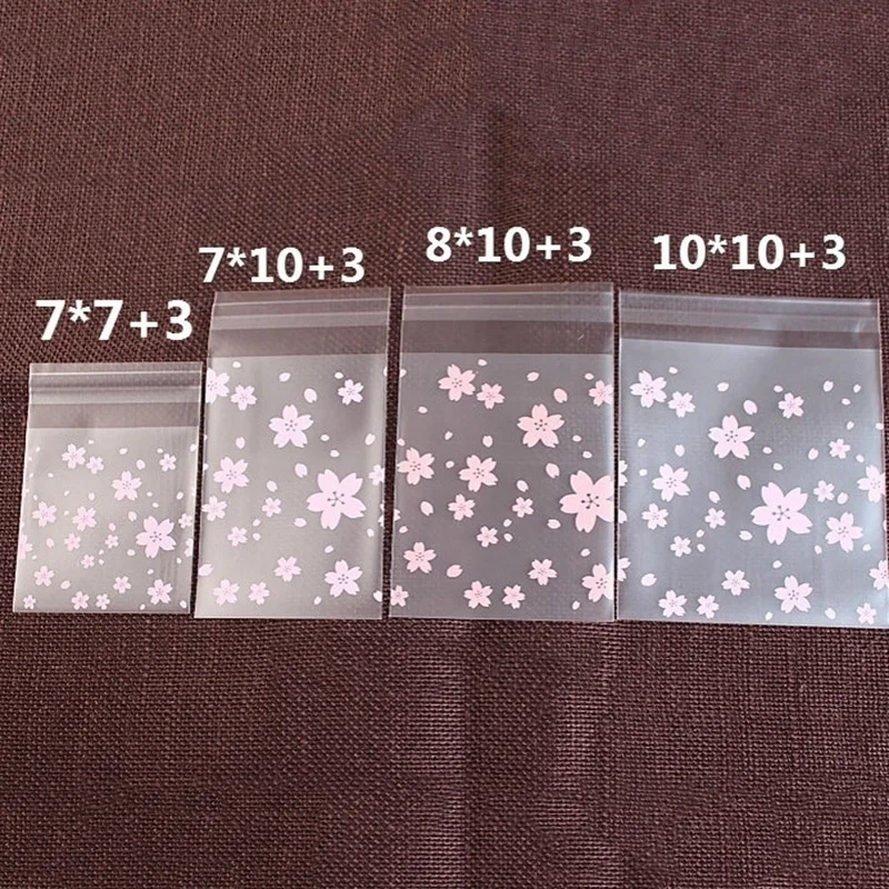 

100pcs Pink Transparent Cherry Blossoms Mini Self Adhesive Scrub Opp Bags DIY